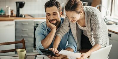 Young couple calculating home finances