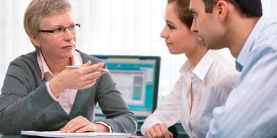 Couple talking to tax preparer