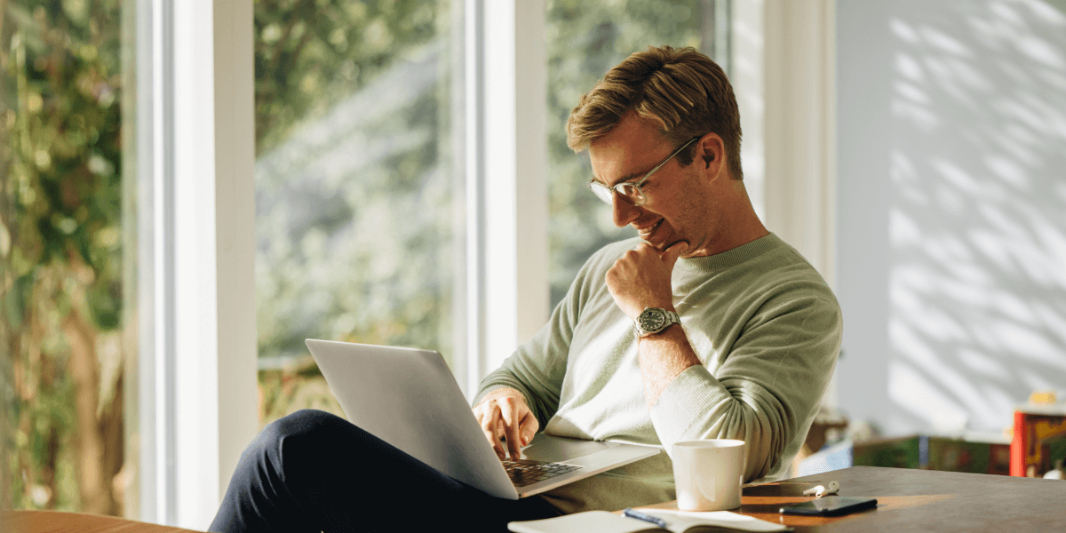 Young man using laptop at home. 