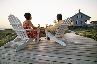Two people sitting in deck chairs